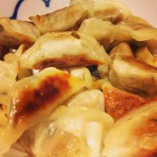 Pile of pan fried Assi Vege Potstickers