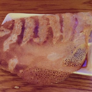 Pork gyoza embedded in a crispy creppe